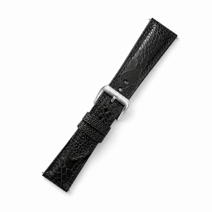 Black ostrich leg watch strap, angled view with brushed steel buckle