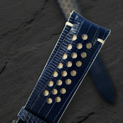 Navy and cream racing rally lizard watch strap, macro of the racing perforations and cream underlay